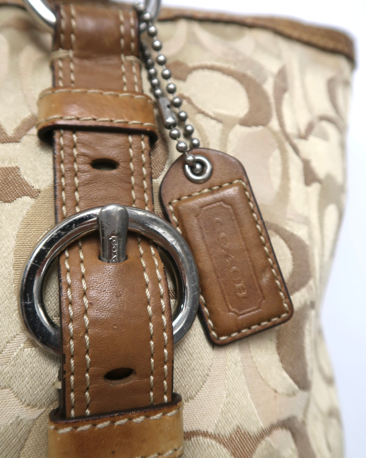 Vintage Coach signature jacquard canvas and tan leather buckle tote bag