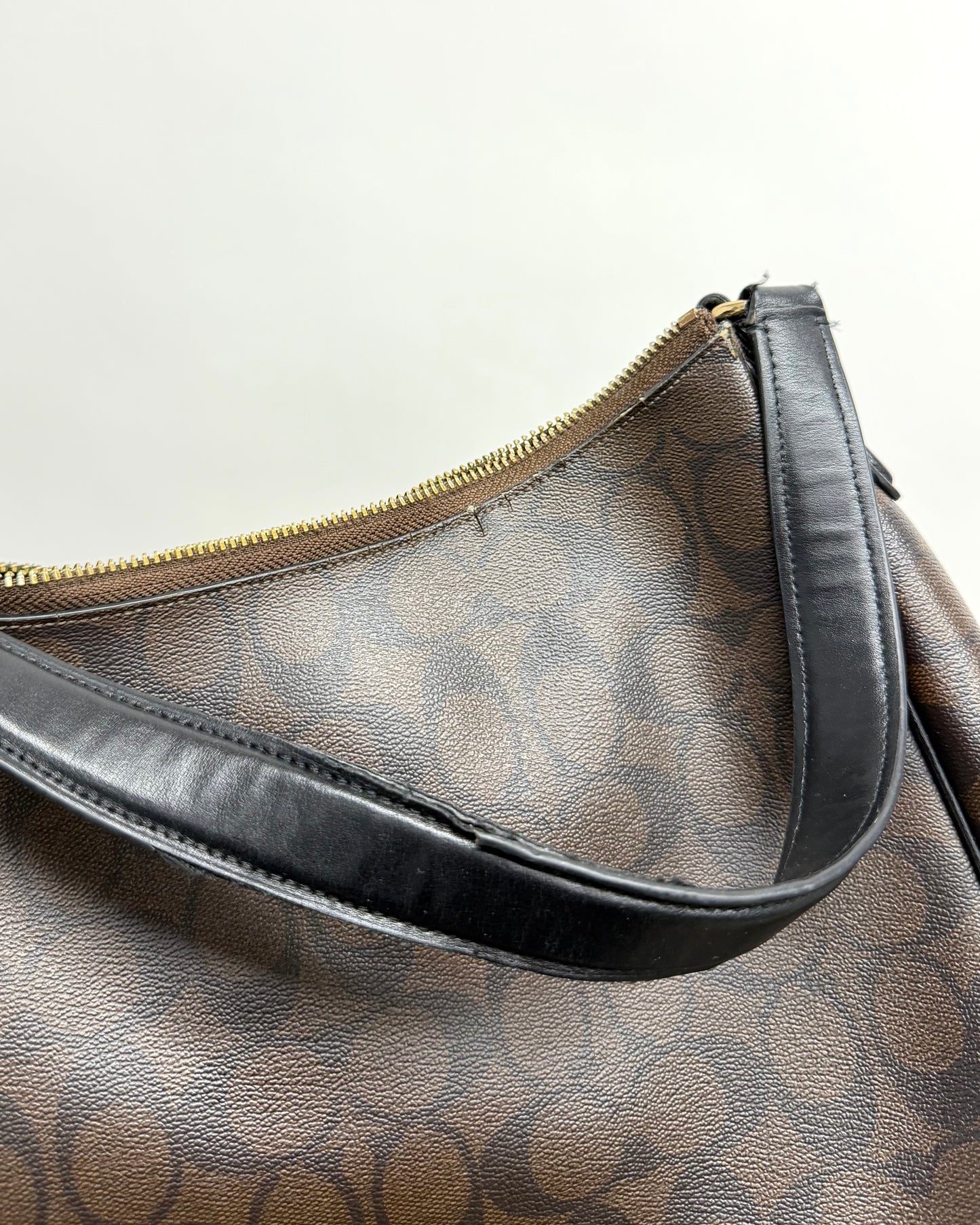 Coach Laurel Shoulder Bag in a dark brown Signature coated canvas with black leather trim and a gold-toned logo