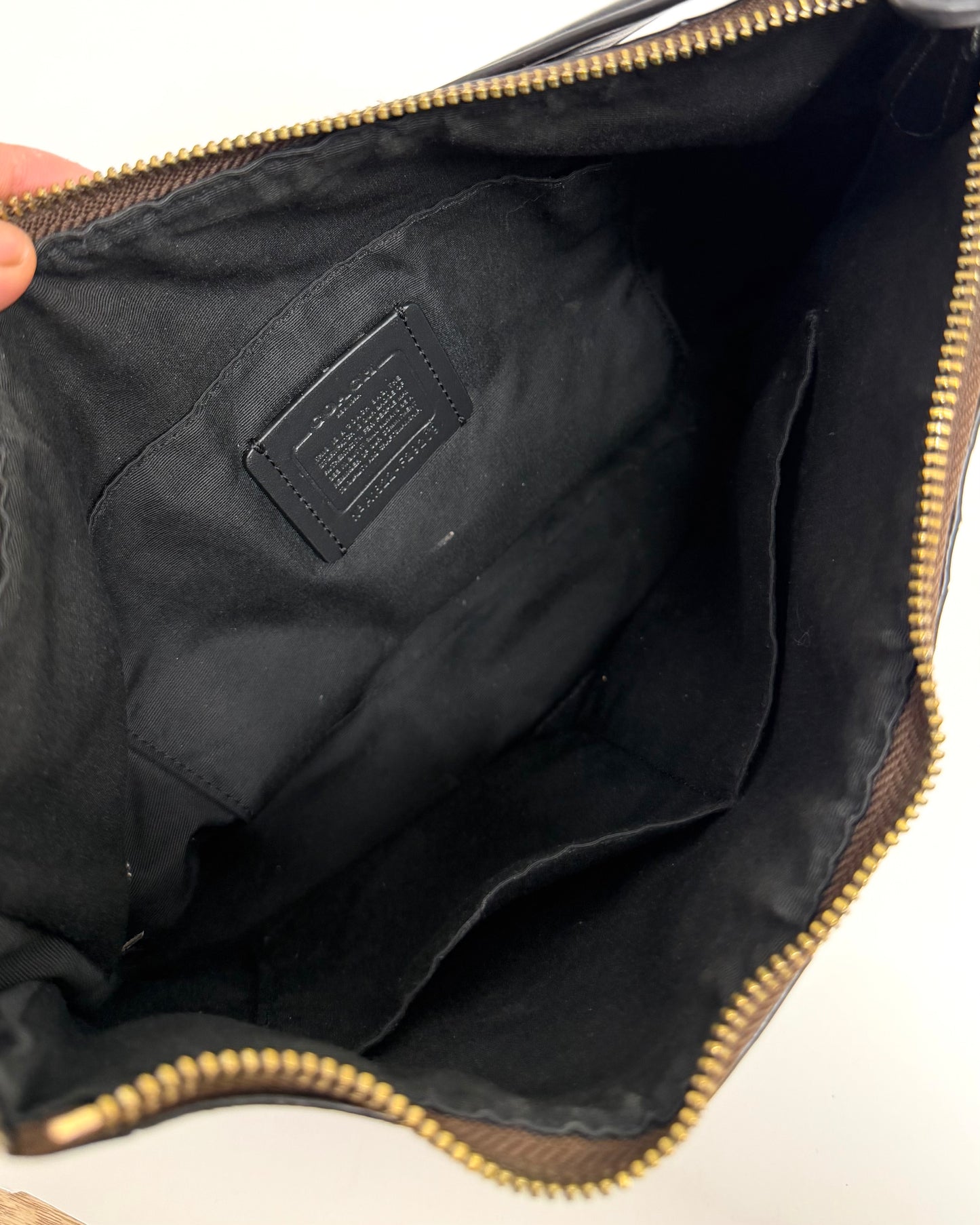Coach Laurel Shoulder Bag in a dark brown Signature coated canvas with black leather trim and a gold-toned logo