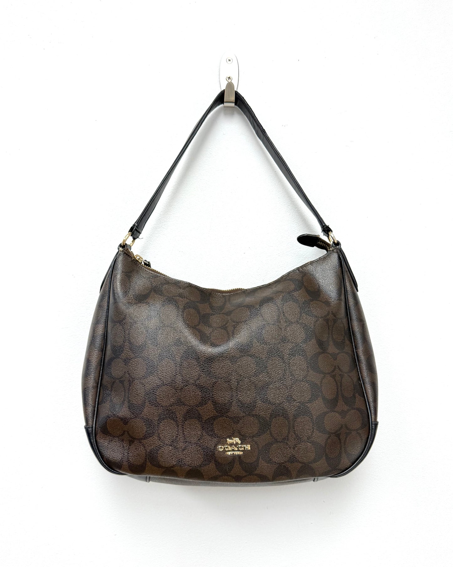 Coach Laurel Shoulder Bag in a dark brown Signature coated canvas with black leather trim and a gold-toned logo