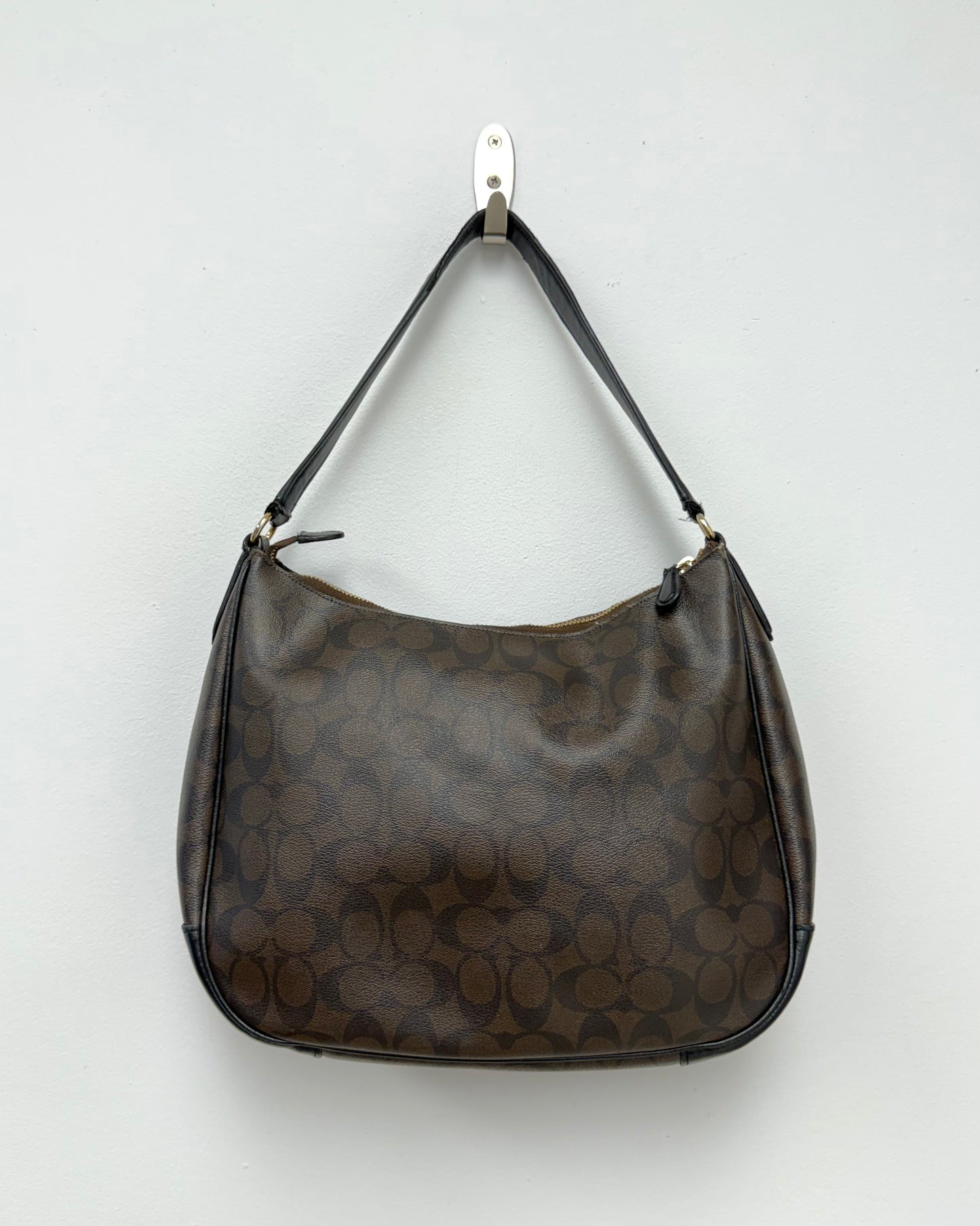 Coach Laurel Shoulder Bag in a dark brown Signature coated canvas with black leather trim and a gold-toned logo