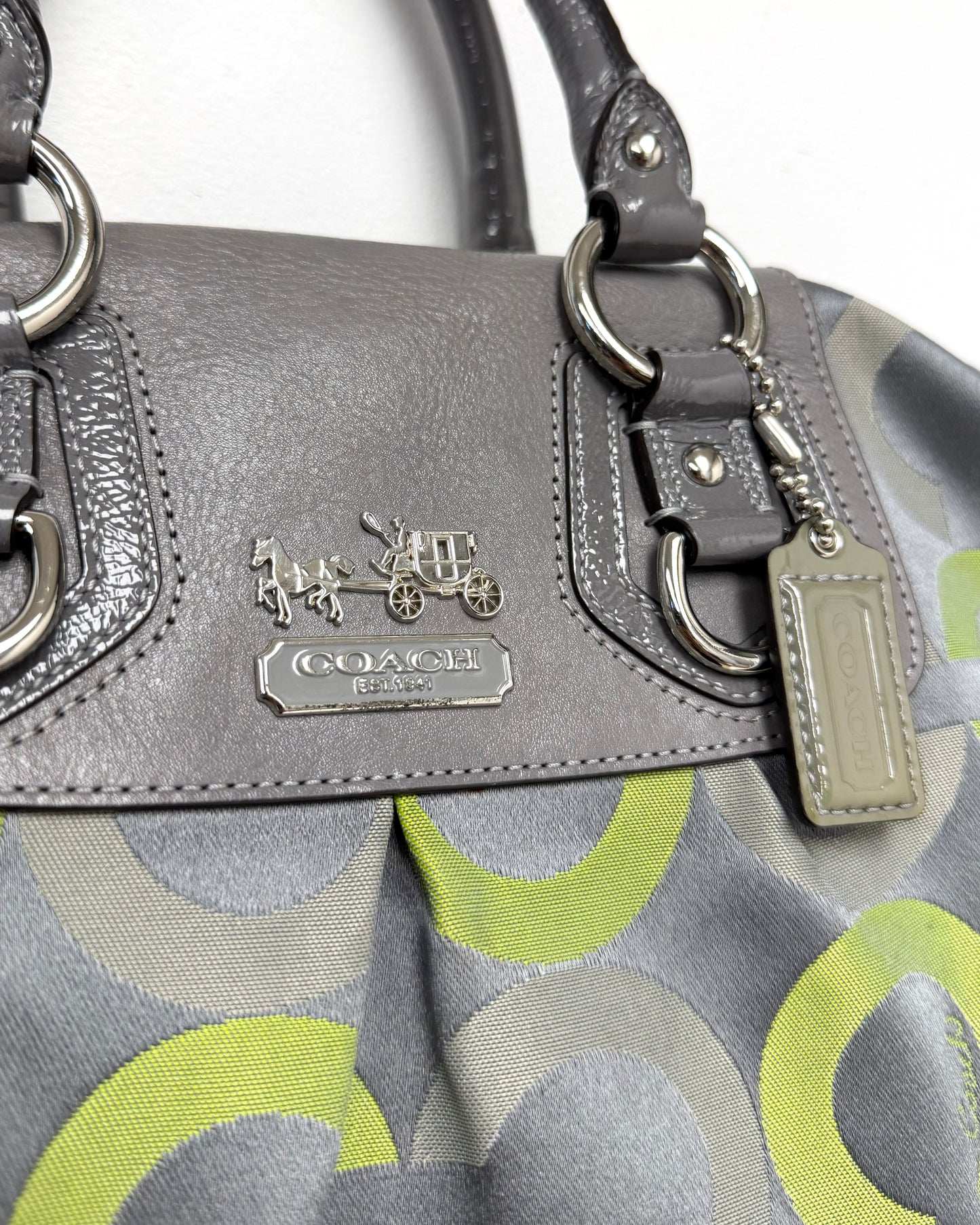 Coach Madison Sabrina Op Art Satchel featuring a gray and lime green sateen print with leather trim