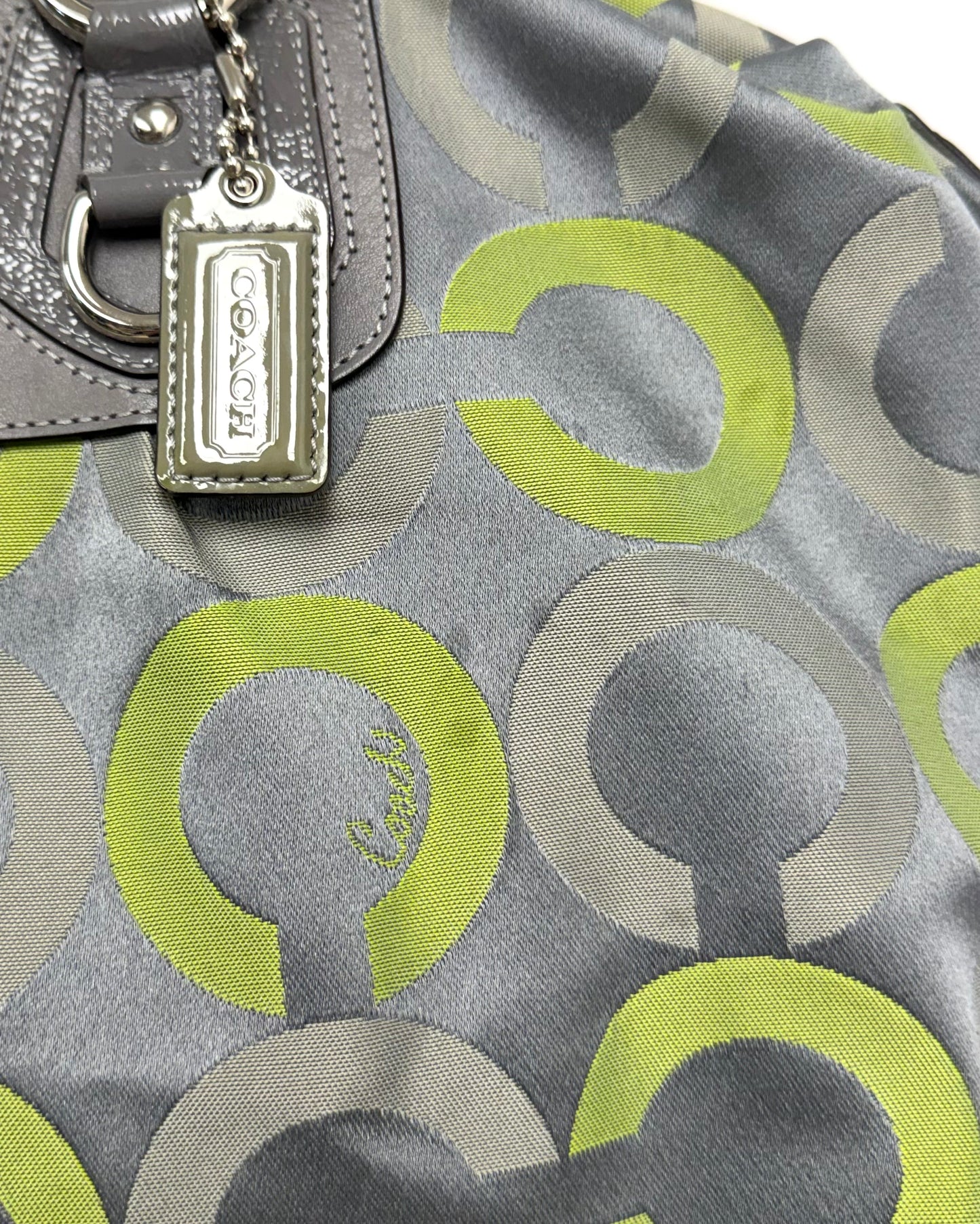 Coach Madison Sabrina Op Art Satchel featuring a gray and lime green sateen print with leather trim