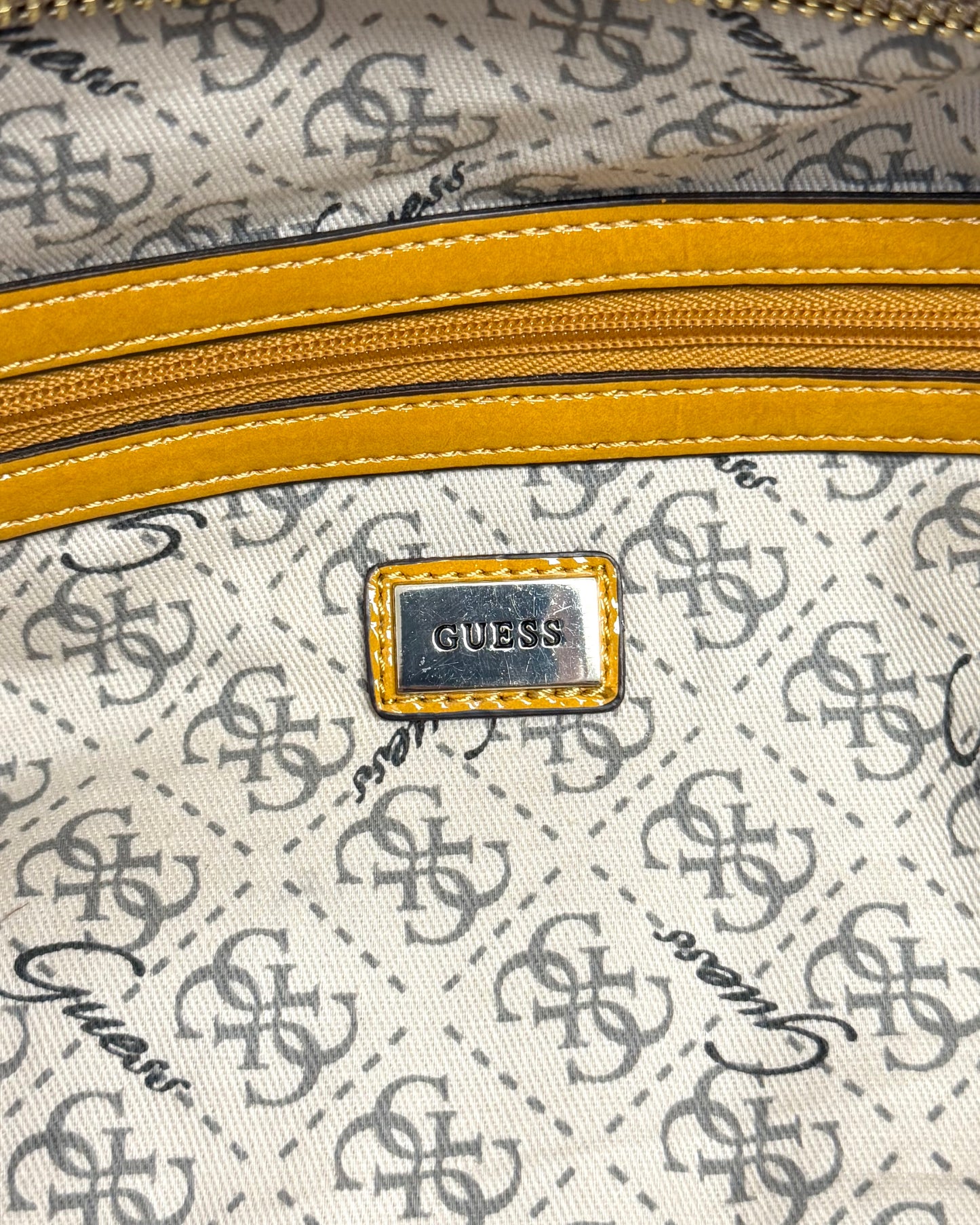 tan snakeskin-textured Guess satchel