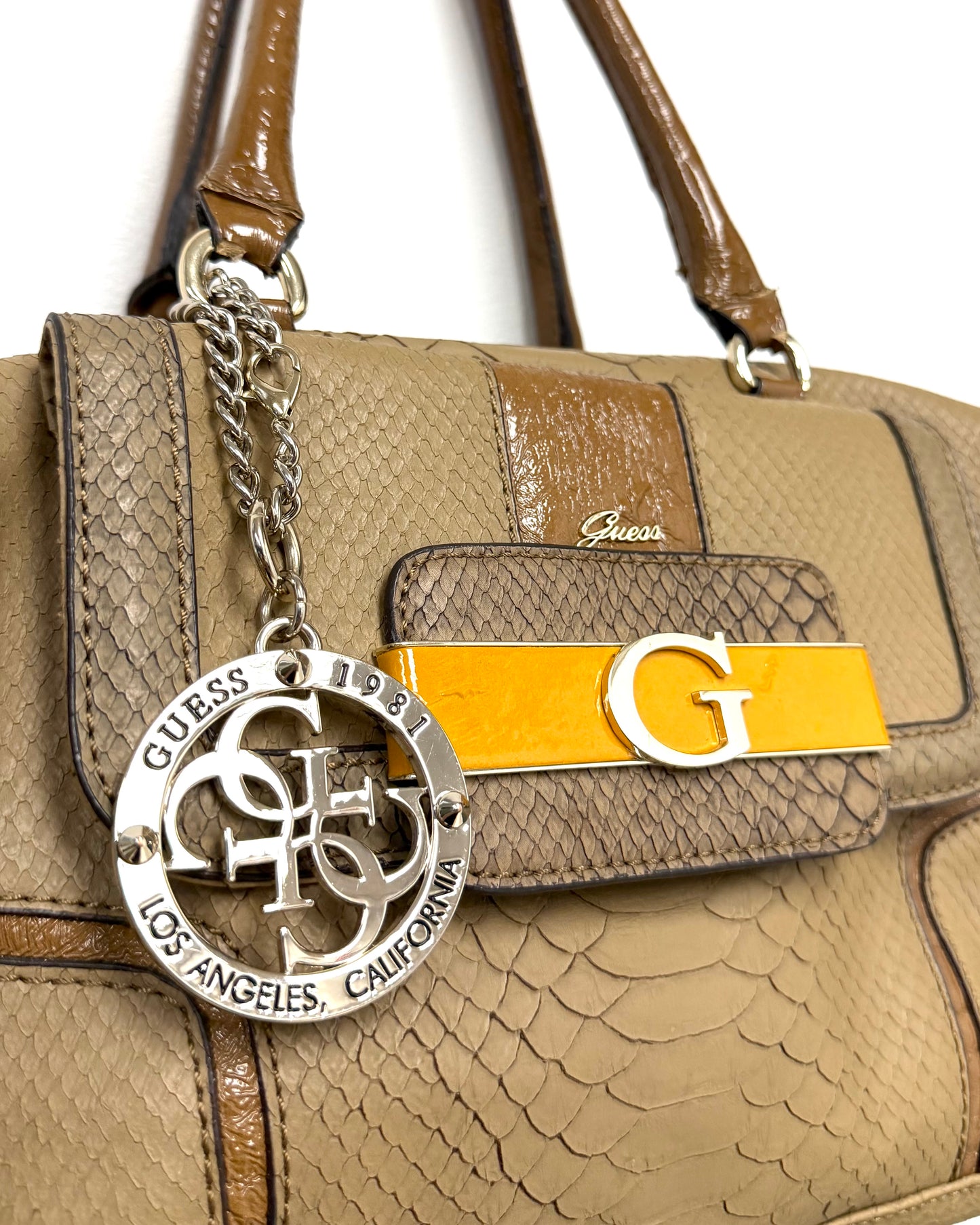 tan snakeskin-textured Guess satchel