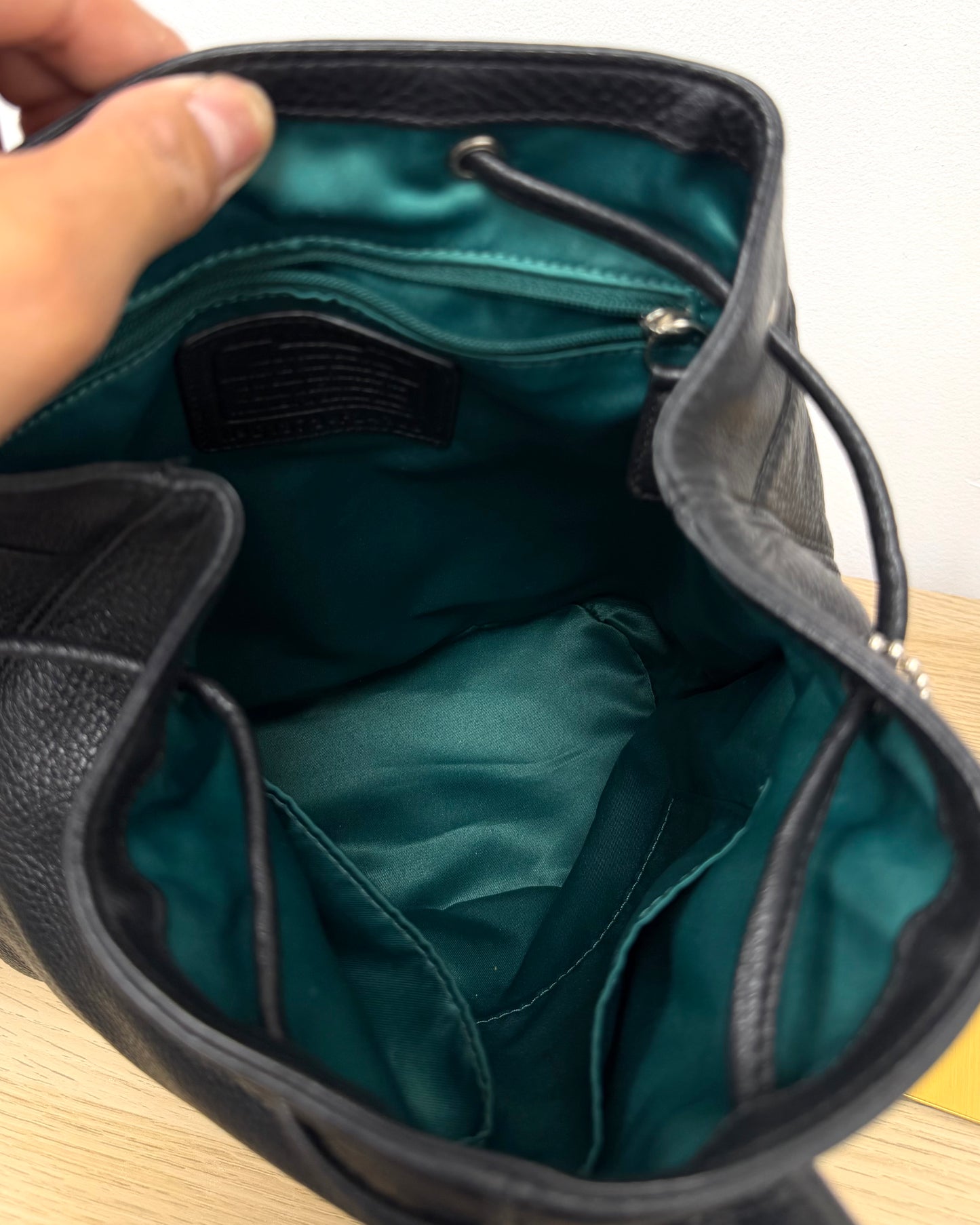 Black Leather Coach backpack