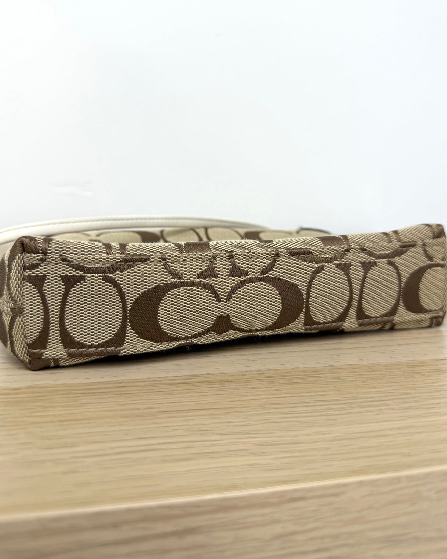 Coach Mini Turn Lock wristlet bag