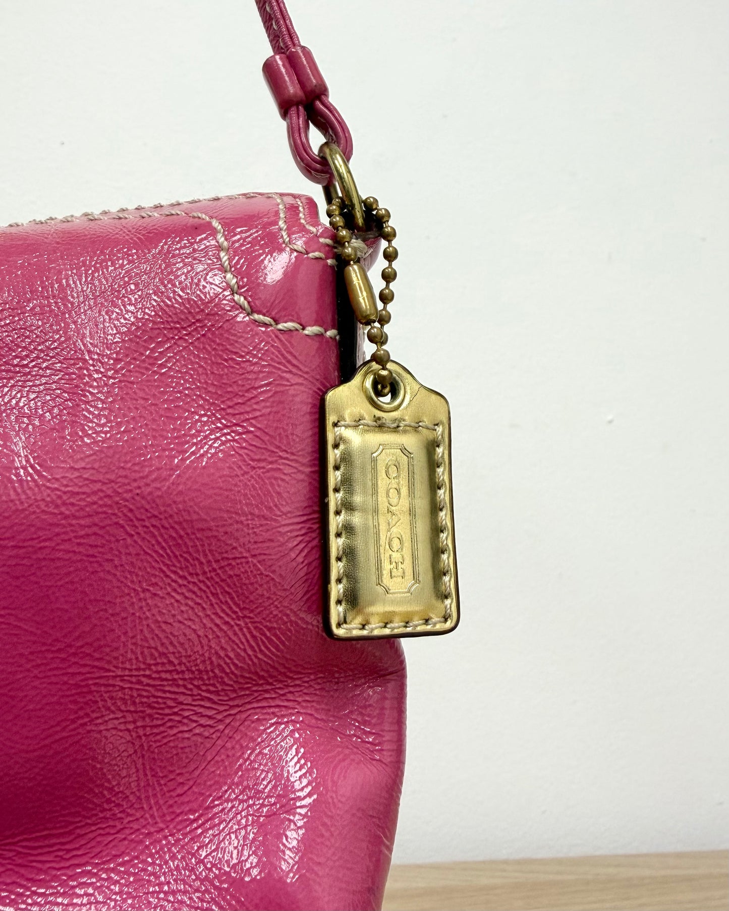 hot pink Coach Chelsea leather wristlet