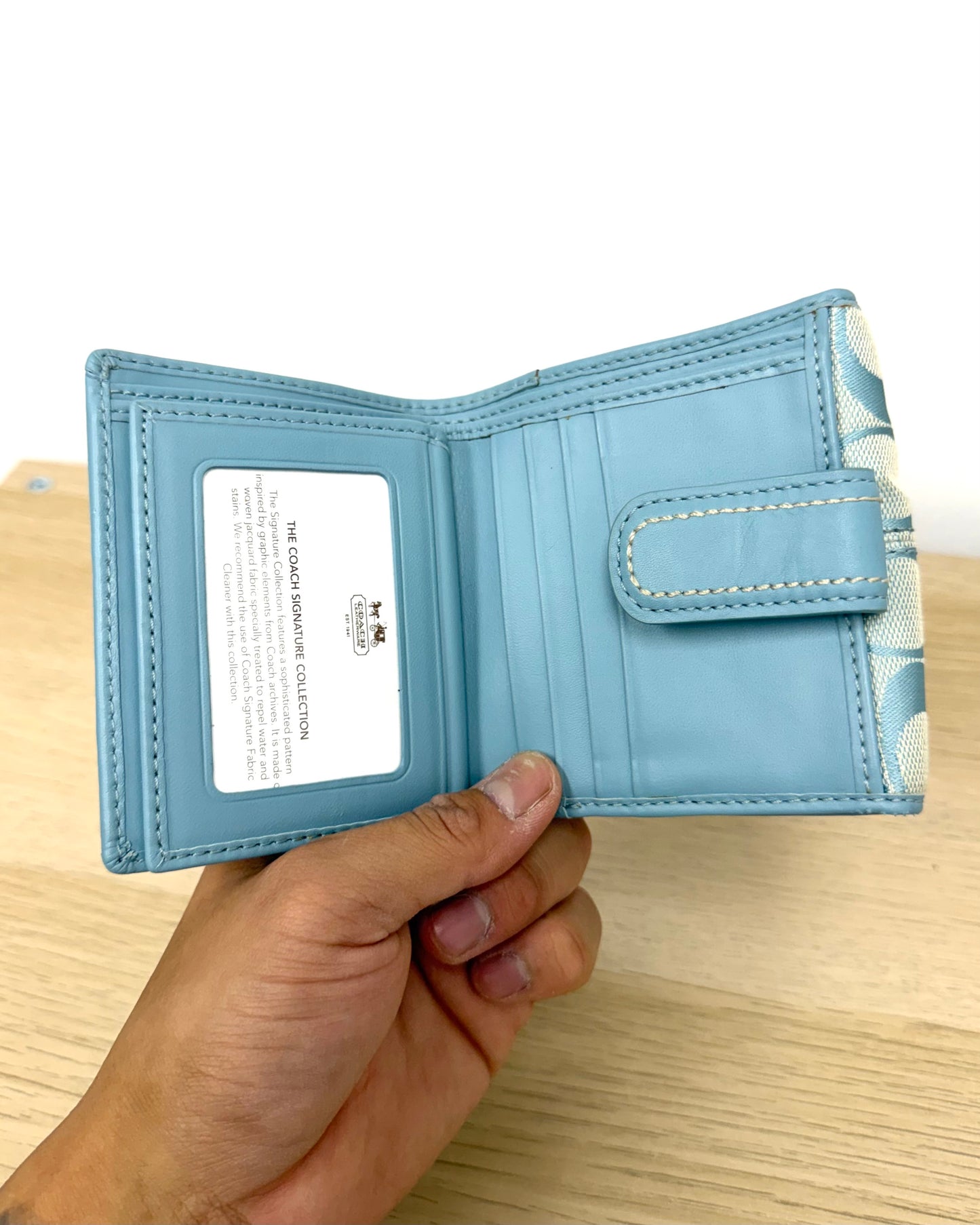 Light blue Coach bifold wallet