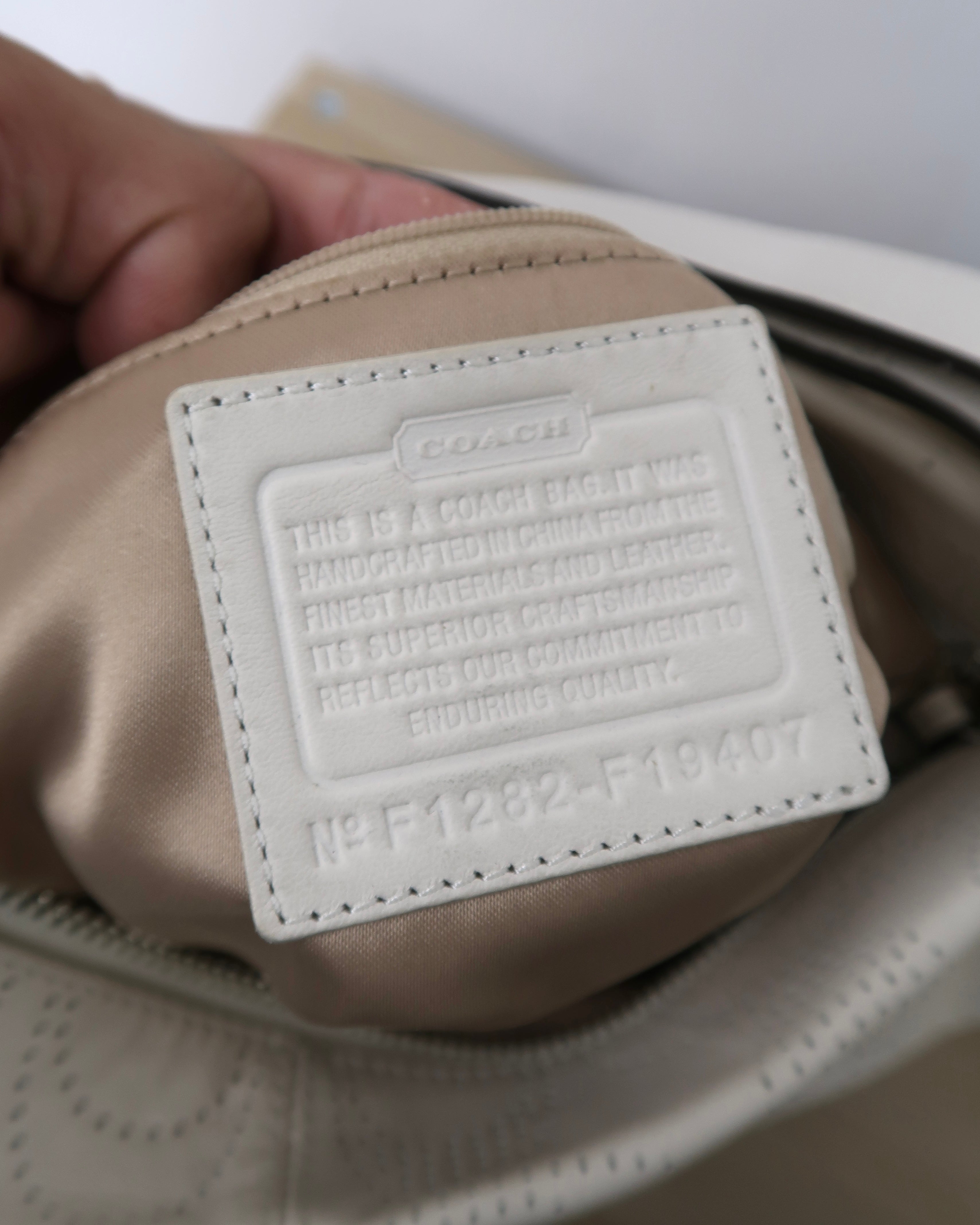 white leather Coach Brooke hobo bag