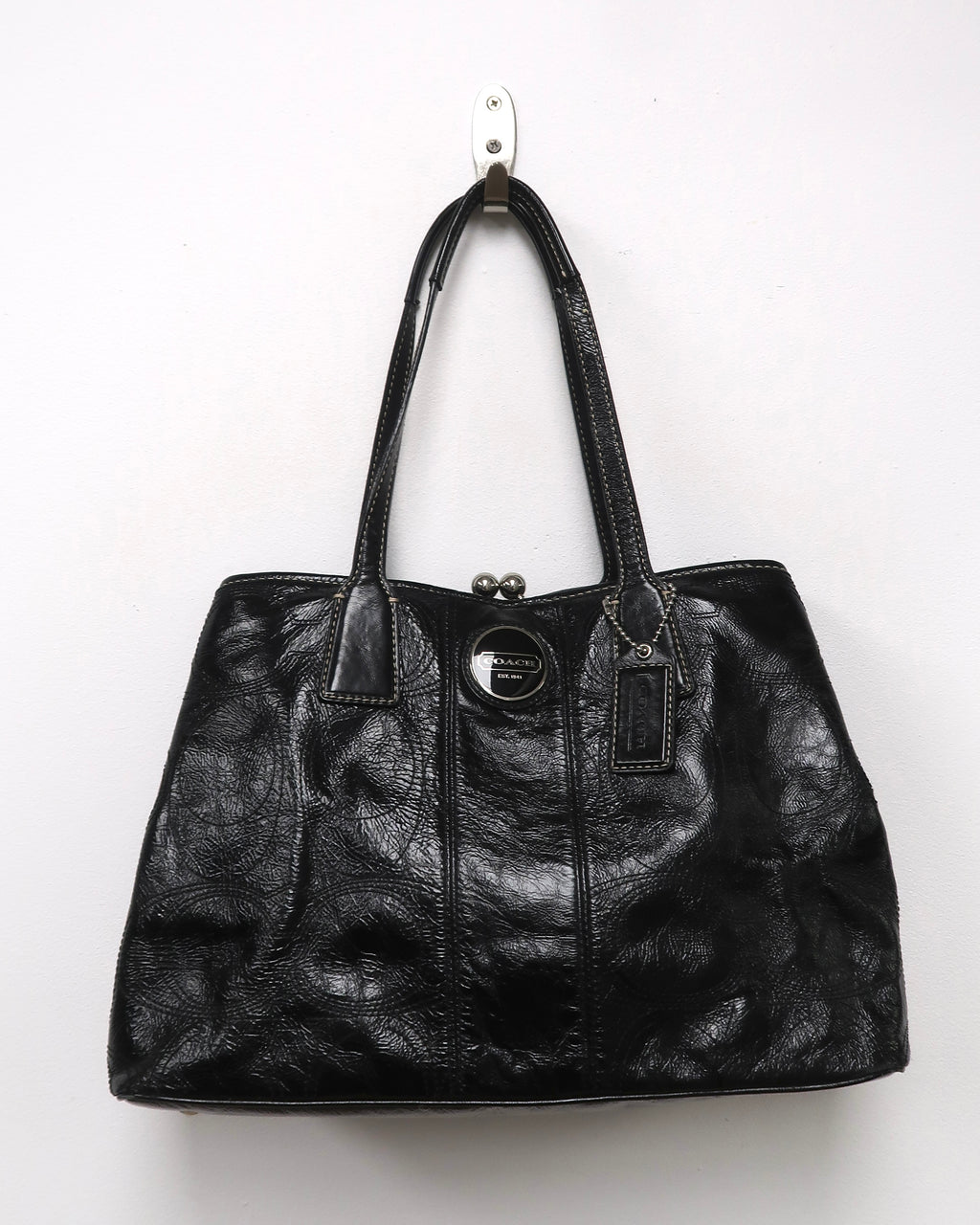 black patent leather Coach Signature Stitch Carryall