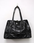 black patent leather Coach Signature Stitch Carryall