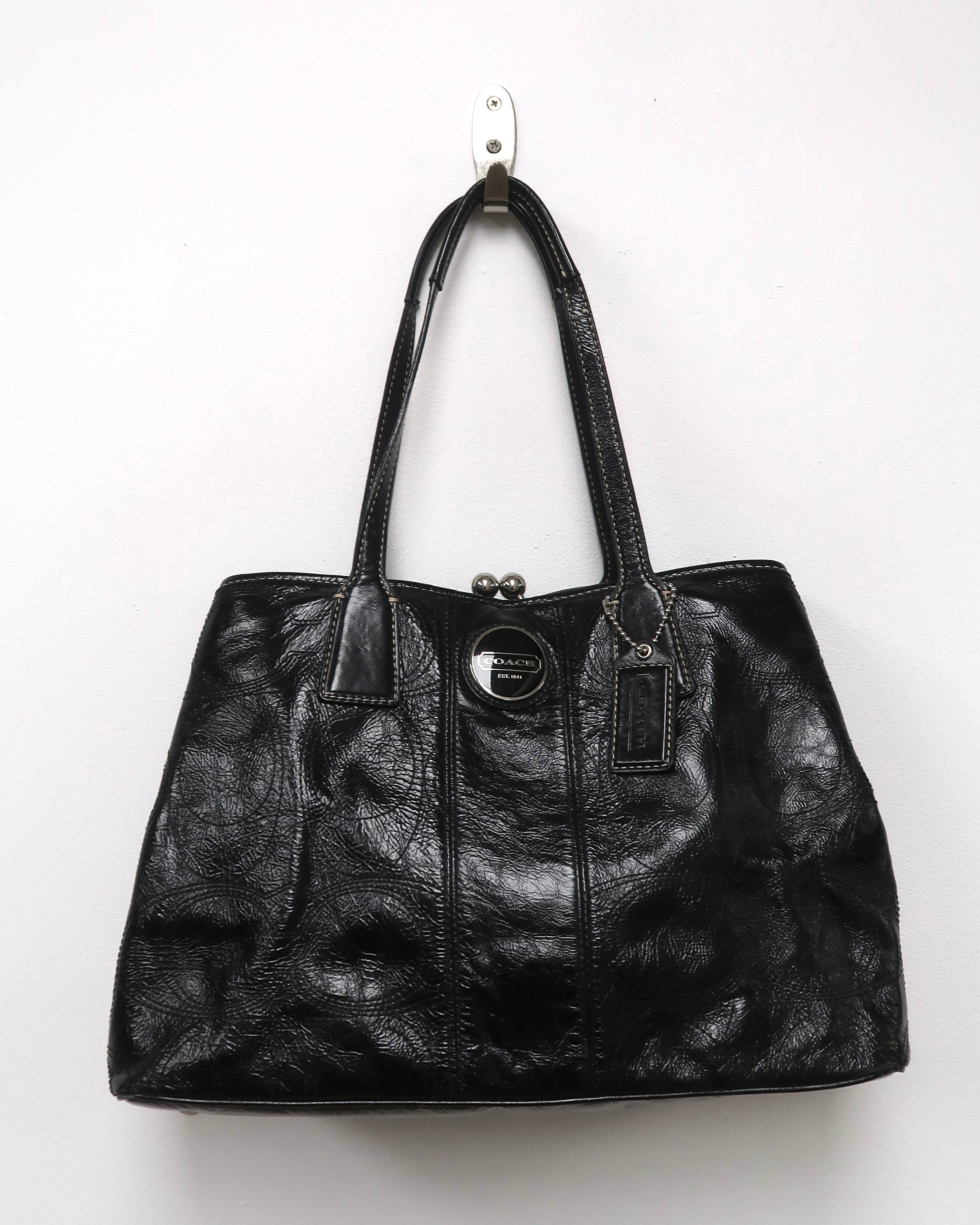 black patent leather Coach Signature Stitch Carryall