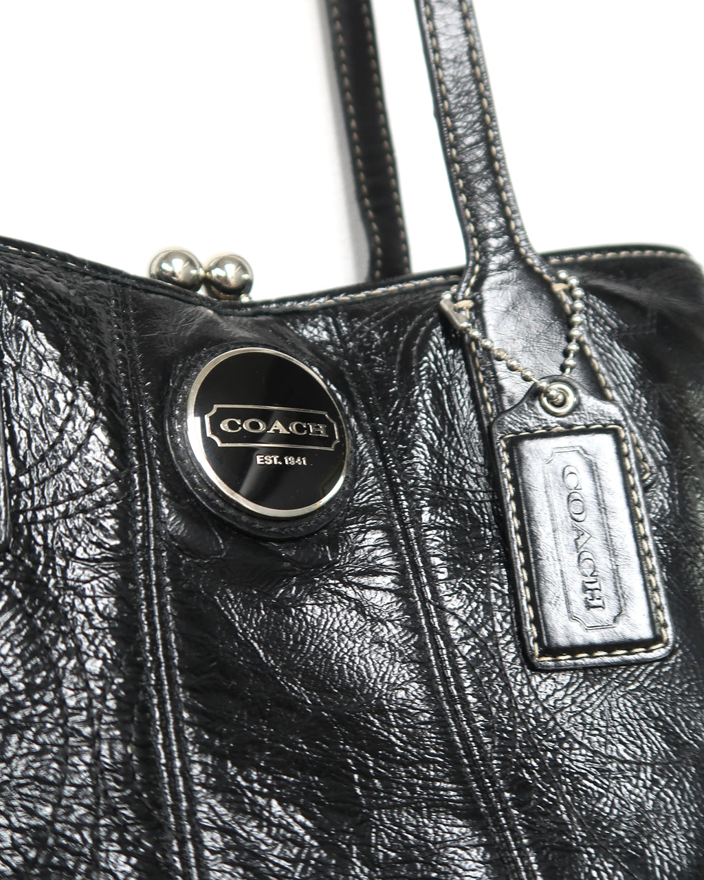 black patent leather Coach Signature Stitch Carryall