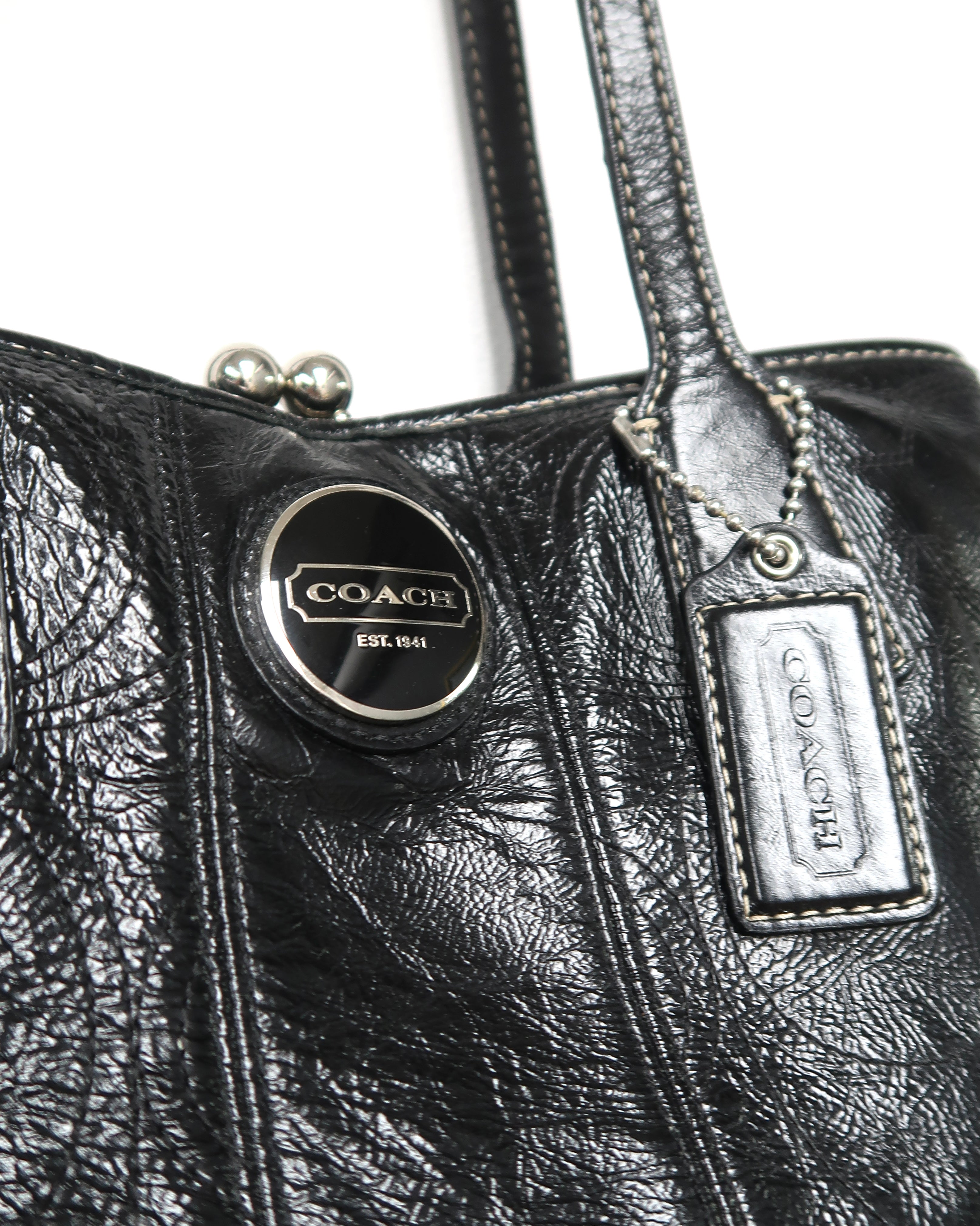 black patent leather Coach Signature Stitch Carryall