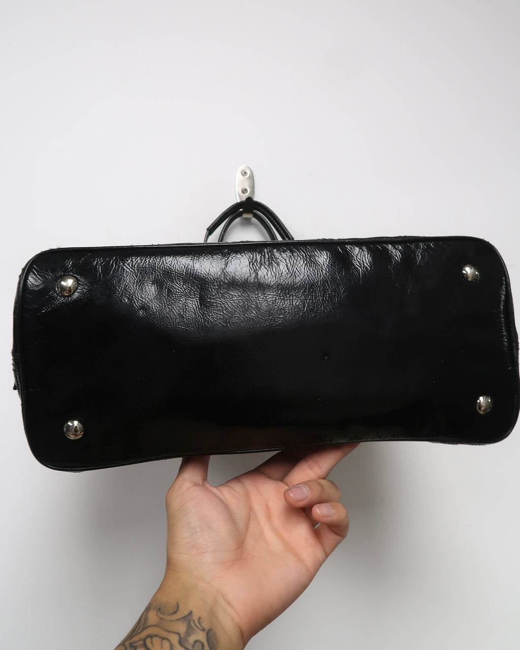 black patent leather Coach Signature Stitch Carryall