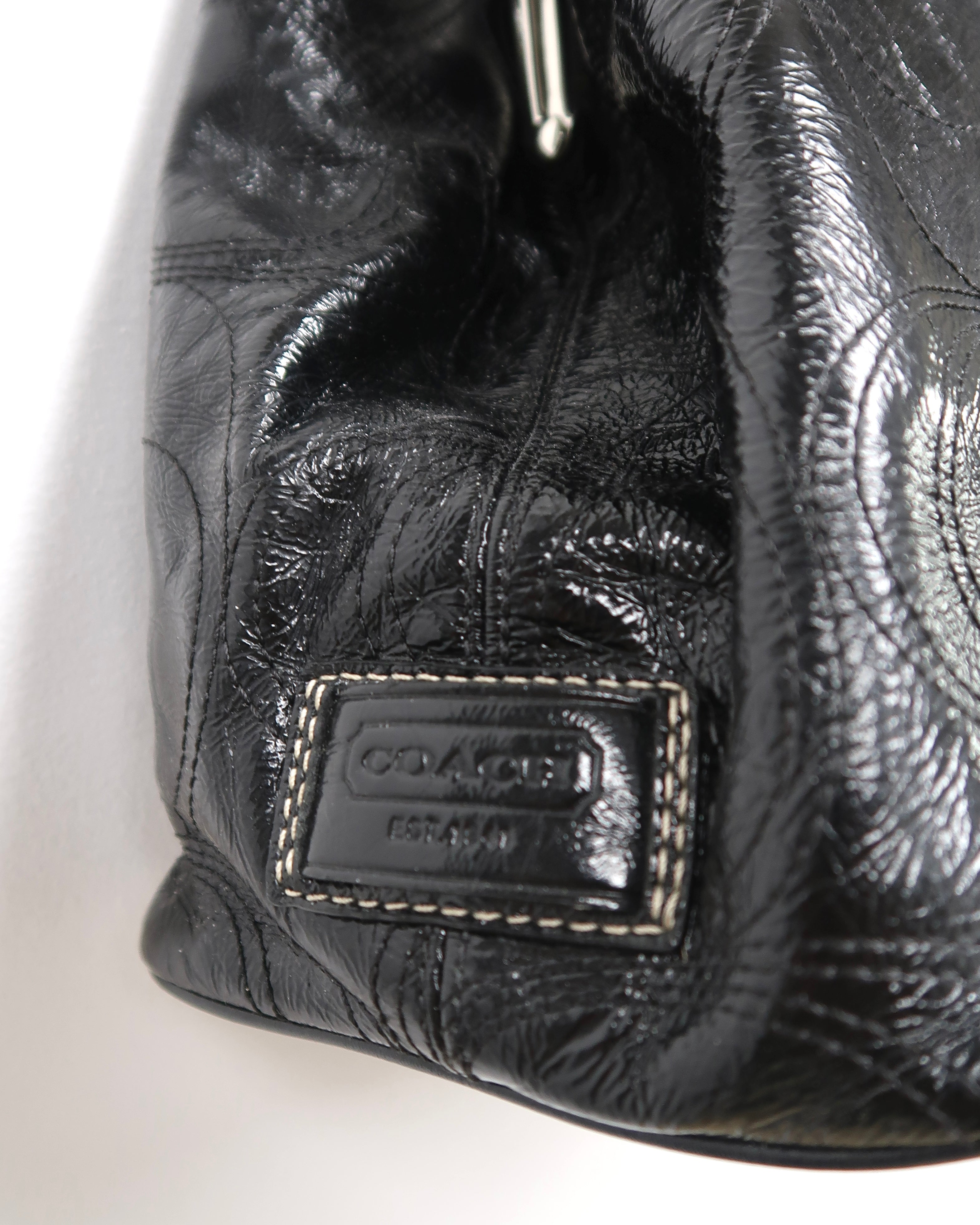 black patent leather Coach Signature Stitch Carryall