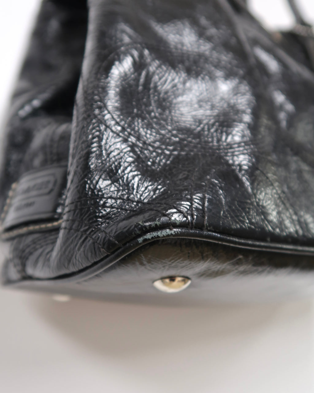 black patent leather Coach Signature Stitch Carryall