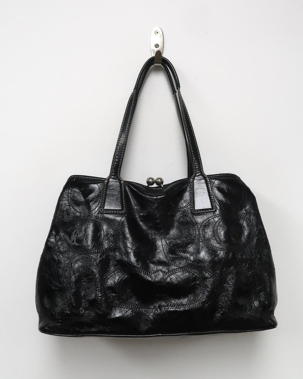 black patent leather Coach Signature Stitch Carryall