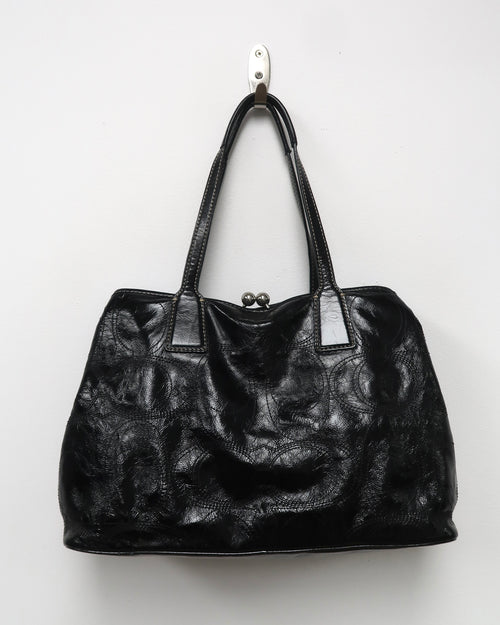 black patent leather Coach Signature Stitch Carryall