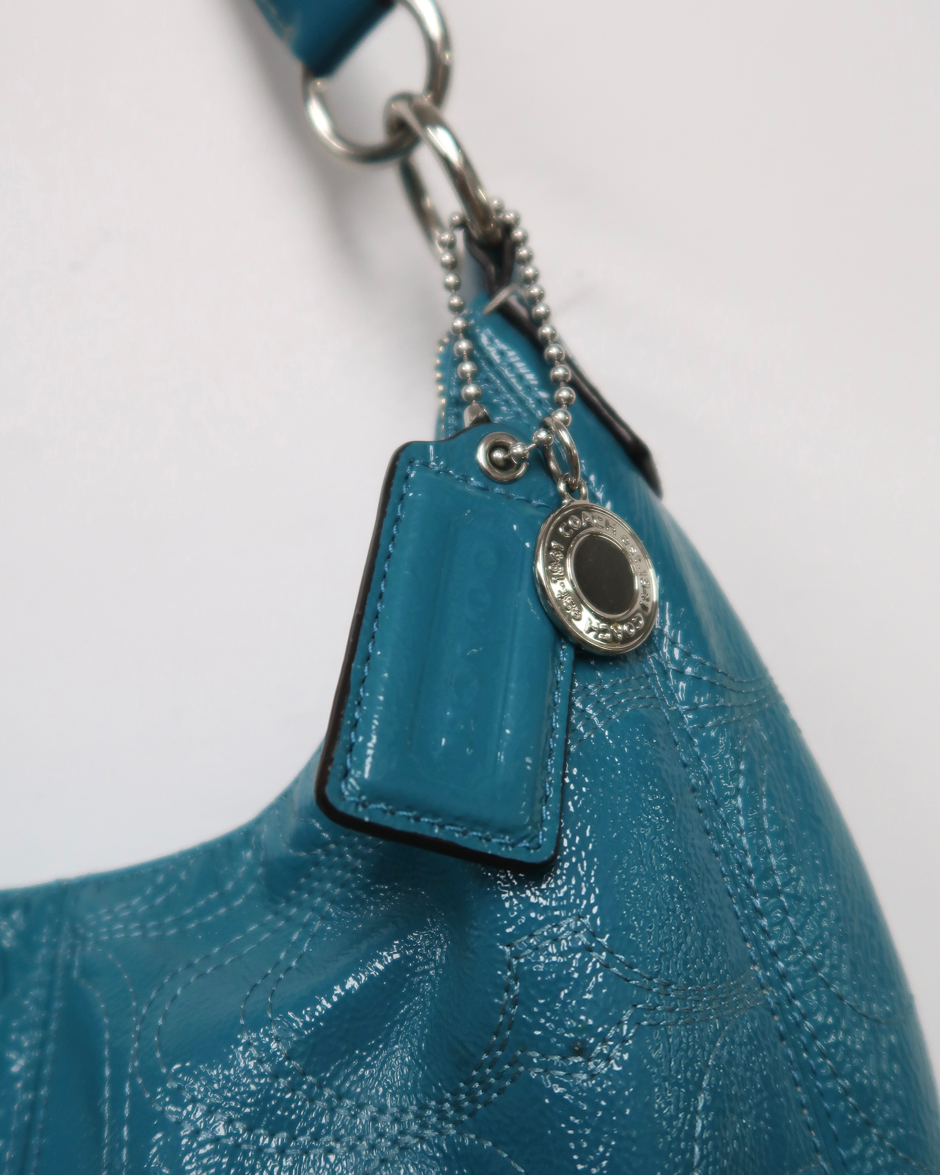 teal Coach Signature Gallery patent leather shoulder bag