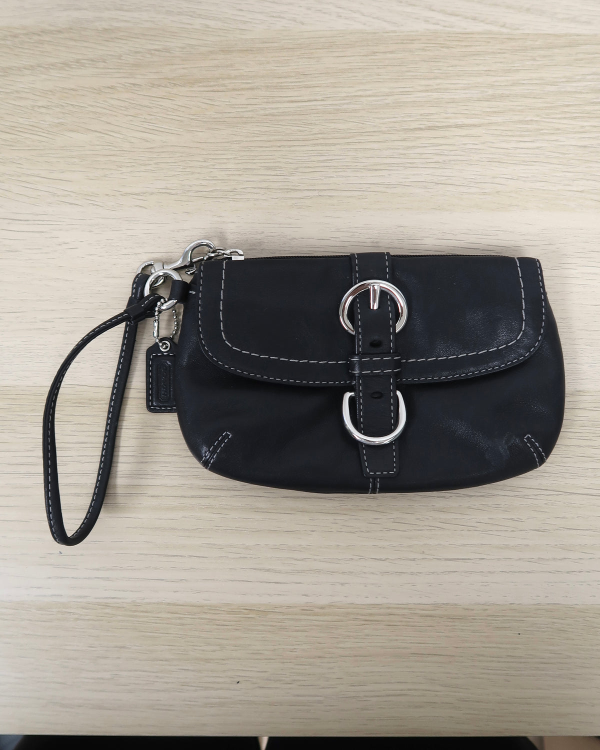 Coach Soho black leather buckle wristlet