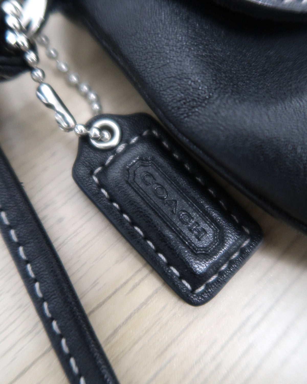 Coach Soho black leather buckle wristlet